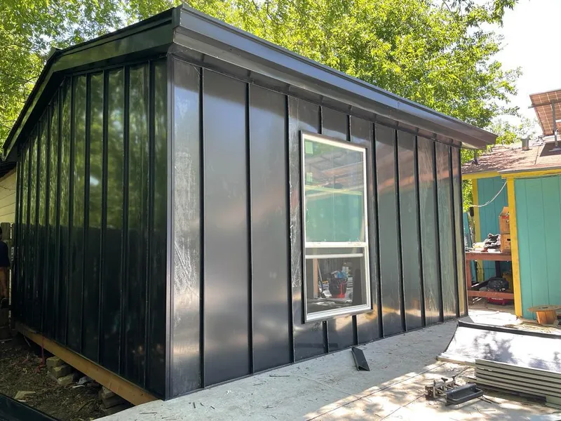 Black standing seam metal wall panels for Roof Inspection in Polk City