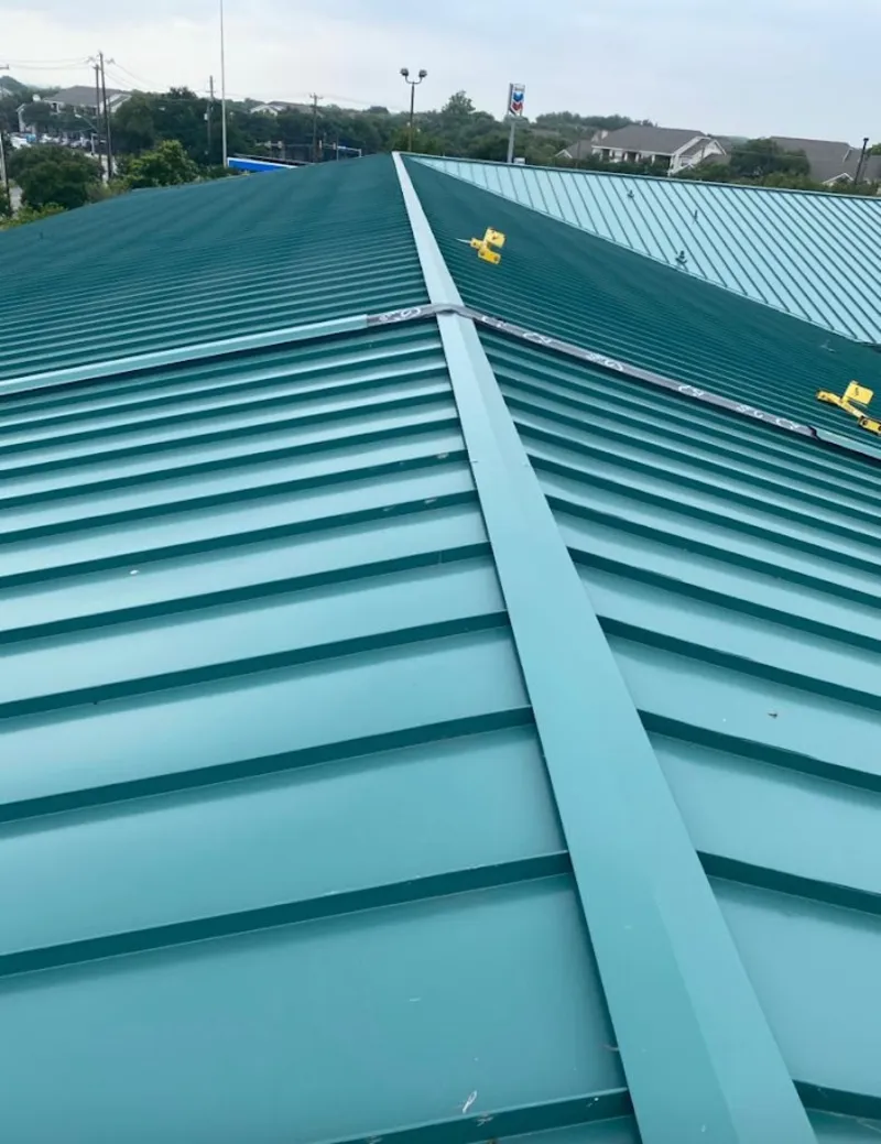 Green commercial metal roof ridge and valley for Metal Roof Repair in Polk City